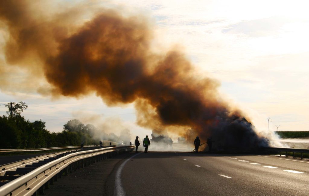 Smoke rising from a truck accident on highway